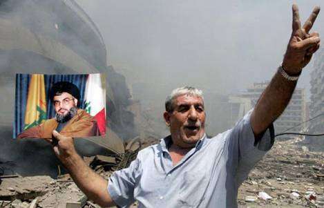اشارة النصر وصورة نصر الله بعد الاعتداء الاسرائيلي على لبنان