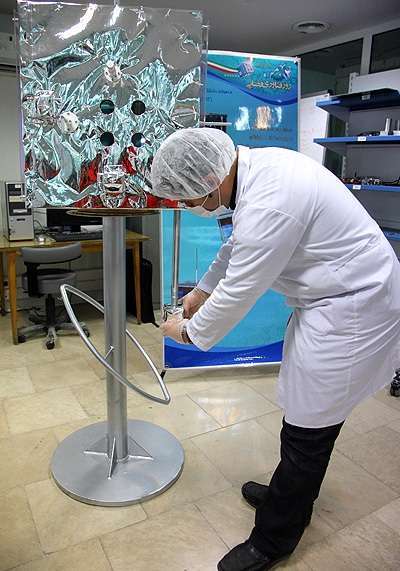 Iran scientists conducting satellite engineering test