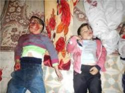 العصابات الوهابية السورية تقتل وتمثل بالنساء والاطفال N00087084-b