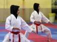 In their Isalmic hijab members of Iranian Women Karate team practice.
