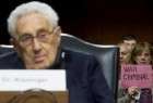 Arrest Henry Kissinger for war crimes, protesters say