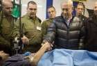 The file photo shows Israel’s Prime Minister Benjamin Netanyahu shaking hands with a militant in an Israeli field hospital in Syria’s occupied Golan Heights.