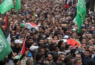 1000s hold funeral for 2 Palestinians killed by Israel