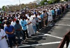 Mourners demand end to hate crimes at slain imam’s funeral