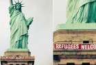 " مرحبا باللاجئين " على تمثال الحرية بنيويورك