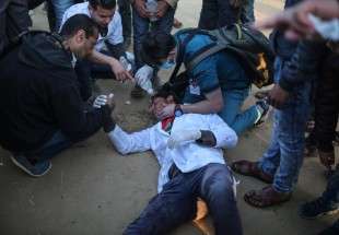 Palestinian medic in Gaza recounts being shot in the leg by Israeli sniper
