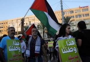 آلاف الفلسطينيين يتظاهرون ضد قانون القومية في تل أبيب