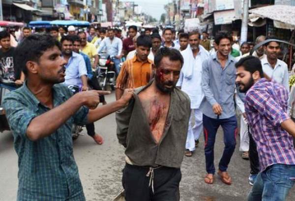 a Muslim man is being thrashed by Hindu extremists from the Bajrang Dal organization in Muzaffarnagar, northern India. (file photo)