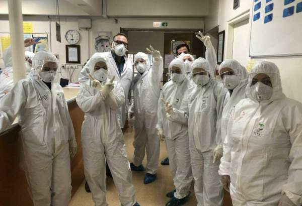 Iranian medical team show victory sign amid hardest times of coronavirus battle.