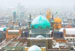 أجواء الحرم الرضوي الطاهر بمدينة مشهد المقدسة في يوم ثلجي وممطر  