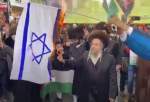 خاخام های یهودی انگلیس پرچم رژیم صهیونیستی را به آتش کشیدند