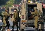 Occupation forces detain 12 Palestinians across West Bank