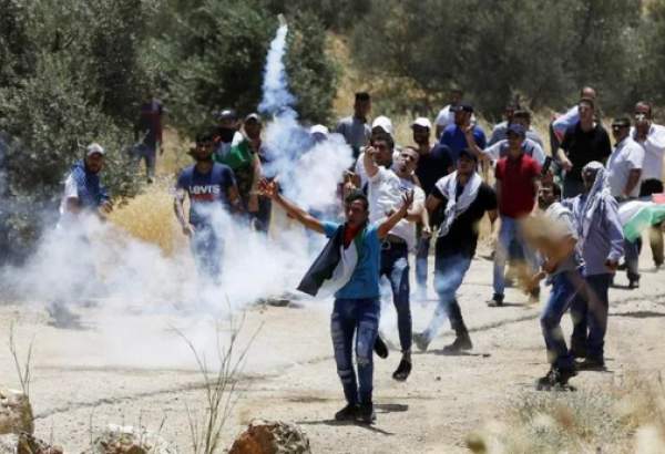 Some 90 Palestinians wounded in clashes with Israeli forces before March of flag