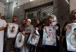 A group of Palestinians perform a demonstration in support of Palestinian detainees in Israeli prisons, carrying posters and photos of the detainees in Gaza City, Gaza on August 09, 2023. [Ali Jadallah – Anadolu Agency]