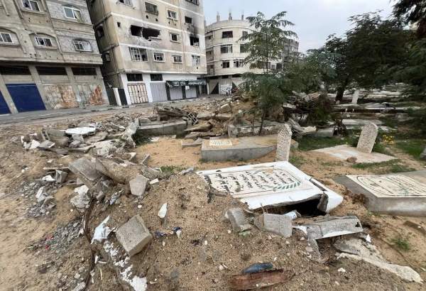 A view of destroyed the Fallujah cemetery, which it used as a headquarters by Israel military, and damaged buildings as Israeli attacks continue on Gaza Strip, on December 14, 2023. [Fadi Alwhidi – Anadolu Agency]