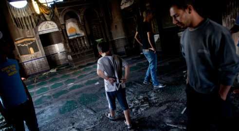 Jewish settlers burn mosques and Korans