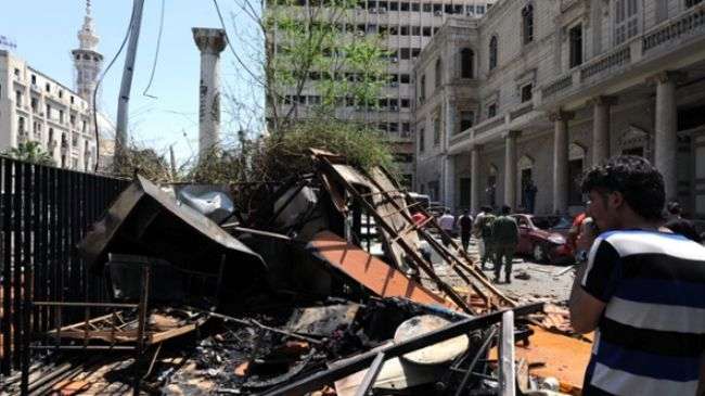 File photo shows the site of a destroyed building following a blast in the Syrian capital, Damascus.