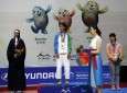 In her full Islamic Hijab, Somayeh Heidari, Iranian martial arts athlete, receives medal in 4th Asian and Martial Arts Games in Incheon 2013.