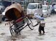 Tropical rain, flood flushes in India