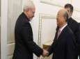Iranian Foreign Minister Mohammad Javad Zarif (L) shakes hands with Director General of the International Atomic Energy Agency (IAEA) Yukiya Amano in Tehran on November 11, 2013.
