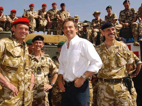 Tony Blair meets troops in Iraq in ۲۰۰۳. A dossier alleging "systematic" war crimes by British forces - sent to Iraq by the former Prime Minister - has been presented to the International Criminal Court (PA)