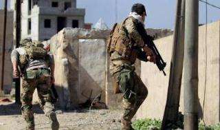 القوات العراقية تواصل تطهيرها مدينة الموصل من براثن داعش