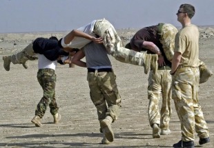 File photo of Iraqi soldiers training with British soldiers inside UK base on the outskirts of Basra, 15 February 2006 (AFP)