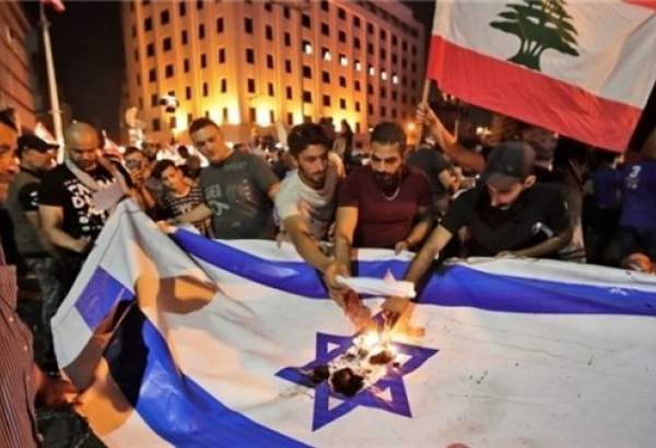 Iraqi, Lebanese anti-government protesters torch US, Israel flags