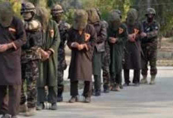 Afghan security forces with captured Taliban members