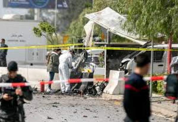 Forensic officers work on a blast site near the US Embassy in Tunis, Friday, March 6, 2020.
