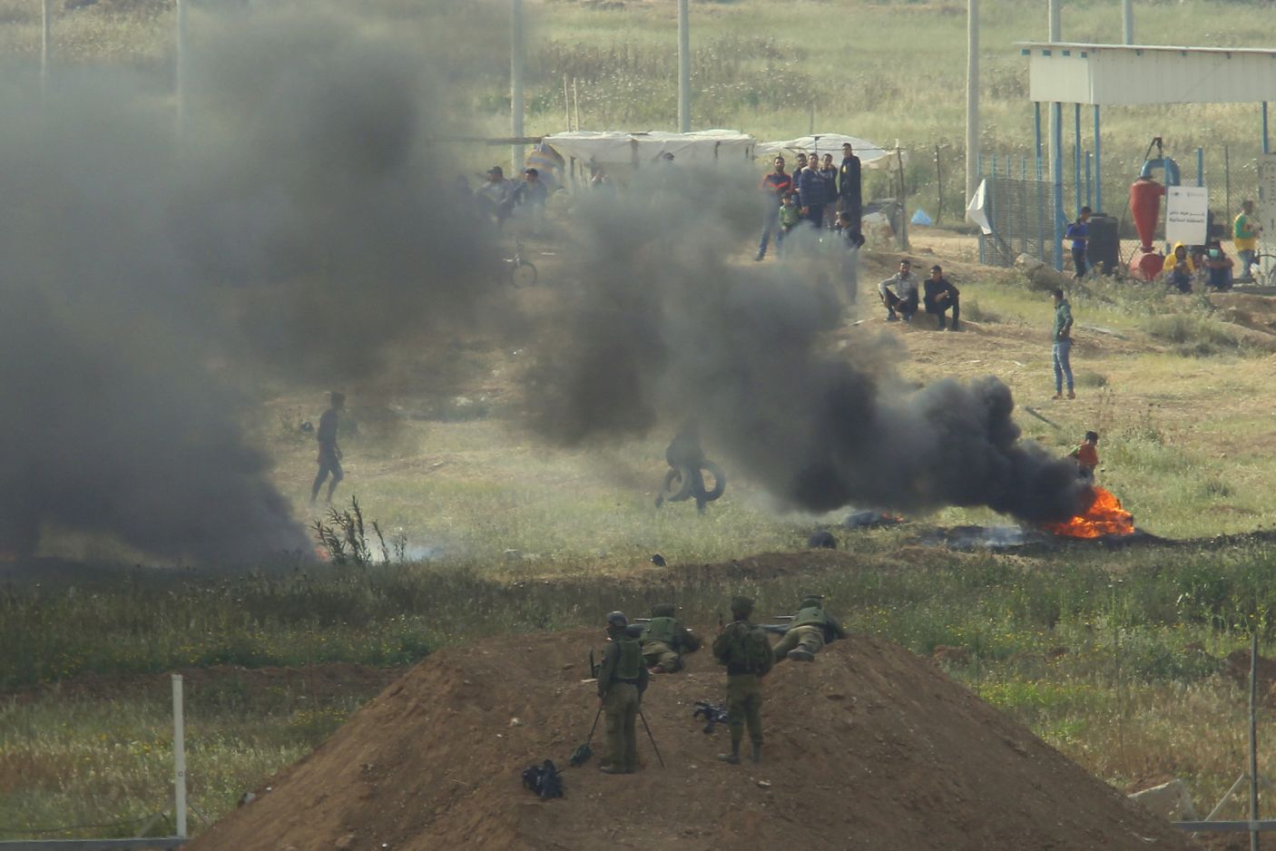 Israeli snipers shooting Palestinian protesters during demonstrations along the border between the occupied lands and besieged Gaza enclave.