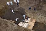 US to bury bodies of coronavirus fatalities in mass graves