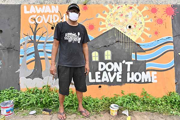 فنانون من إندونيسيا يحاربون فيروس كورونا بالجرافيتى  