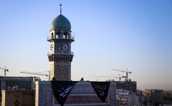 Black flag for Muharram mourning procession hoisted at holy shrine of Imam Reza, Iran (photo)  