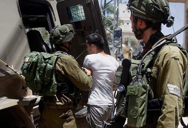 Israeli occupation forces detaining Palestinians in the occupied territories.