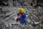 Volunteers entertain Gaza children amid the debris of homes (photo)  