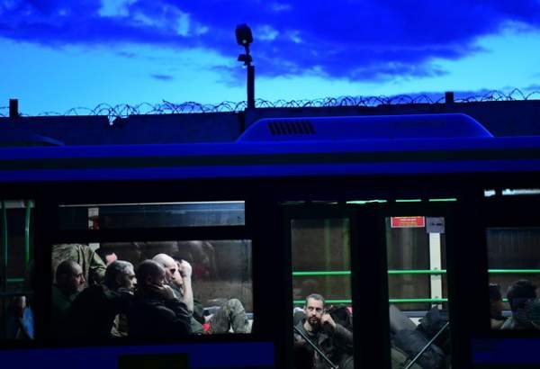 FILE PHOTO: Ukrainian fighters from besieged Azovstal steel plant who have surrendered wait in a bus outside a pre-trial detention centre, Donetsk People