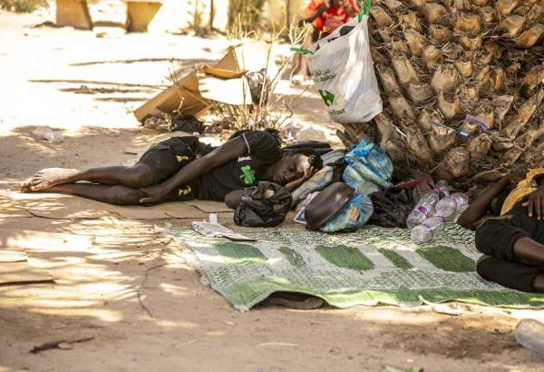 A Sudanese irregular migrant rests on the ground in a park in which he lives under difficult conditions, in Sfax province of Tunisia, as they wait for an opportunity to seek asylum in Europe illegally, [Yassine Gaidi – Anadolu Agency]