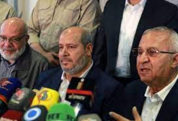 Senior official of the Palestinian Islamic Jihad movement, Abdulaziz al-Minawi (L), Hamas arab relations chief Khalil al-Hayya (C), and secretary general of the Popular Front for the Liberation of Palestine-General Command, Talal Naji, hold a press conference on 19 October, 2022 [LOUAI BESHARA/AFP via Getty Images]