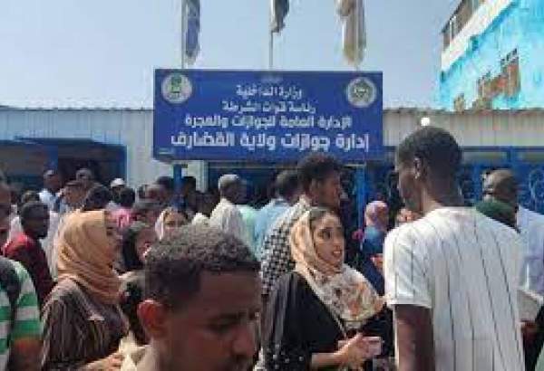 Sudanese queue outside a passport office in Gedaref on September 3, 2023, following an announcement by the authorities of the resumption of issuing passports in war-torn Sudan [AFP via Getty Images]